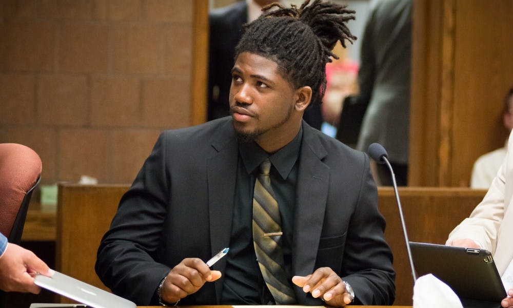 <p>Former MSU football player Auston Roberston looks to his attorney on June 22, 2017, at the 55th District Court in Mason, Michigan. At the hearing Judge Thomas P. Boyd ordered an additional count of third-degree criminal sexual conduct be charged against Robertson for his alleged role in a sexual assault in April.</p>