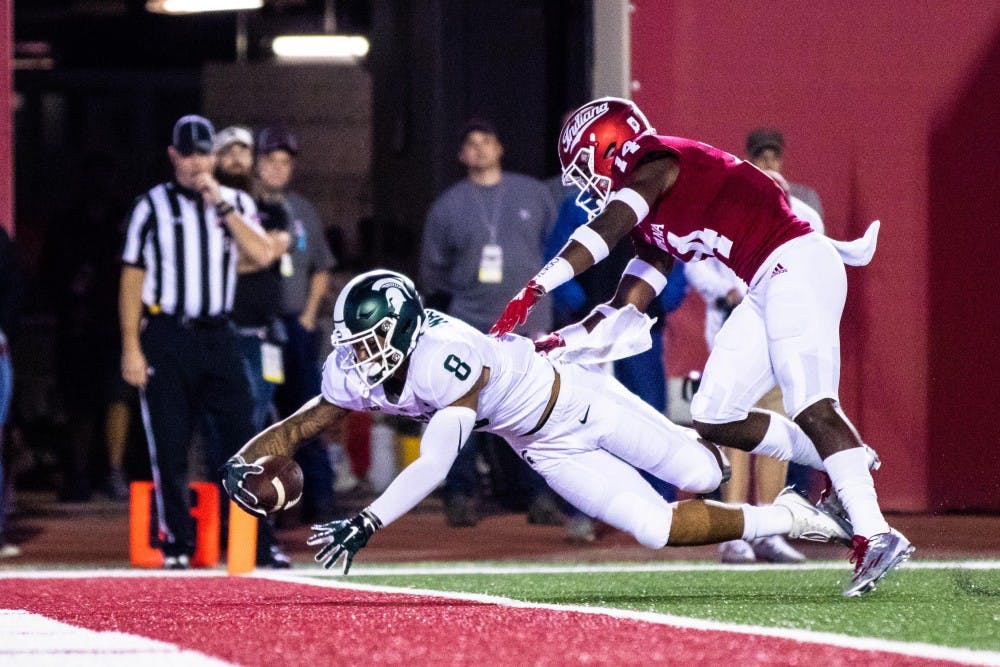 <p>Freshman wide reciever Jalen Nailor (8) reaches out for a touchdown during the game against Indiana on Sept. 22, 2018 at Memorial Stadium. The Spartans defeated the Hoosiers, 35-21.</p>
