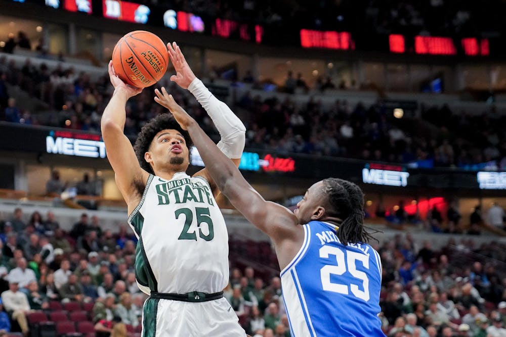 <p>Graduate student forward Malik Hall (25) attempts to score during the Champions Classic at the United Center on Nov. 14, 2023. The Spartans fell to the Blue Devils with a score of 74-65.</p>