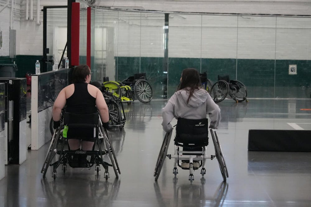 Michigan State Students who participate in Adaptive Recreation roll in their wheelchairs around Demonstration hall on Oct. 5th, 2024. Adaptive Recreation is a program through MSU Recreational sports to give everyone a chance to play team sports such as basketball, pickleball, and volleyball. 