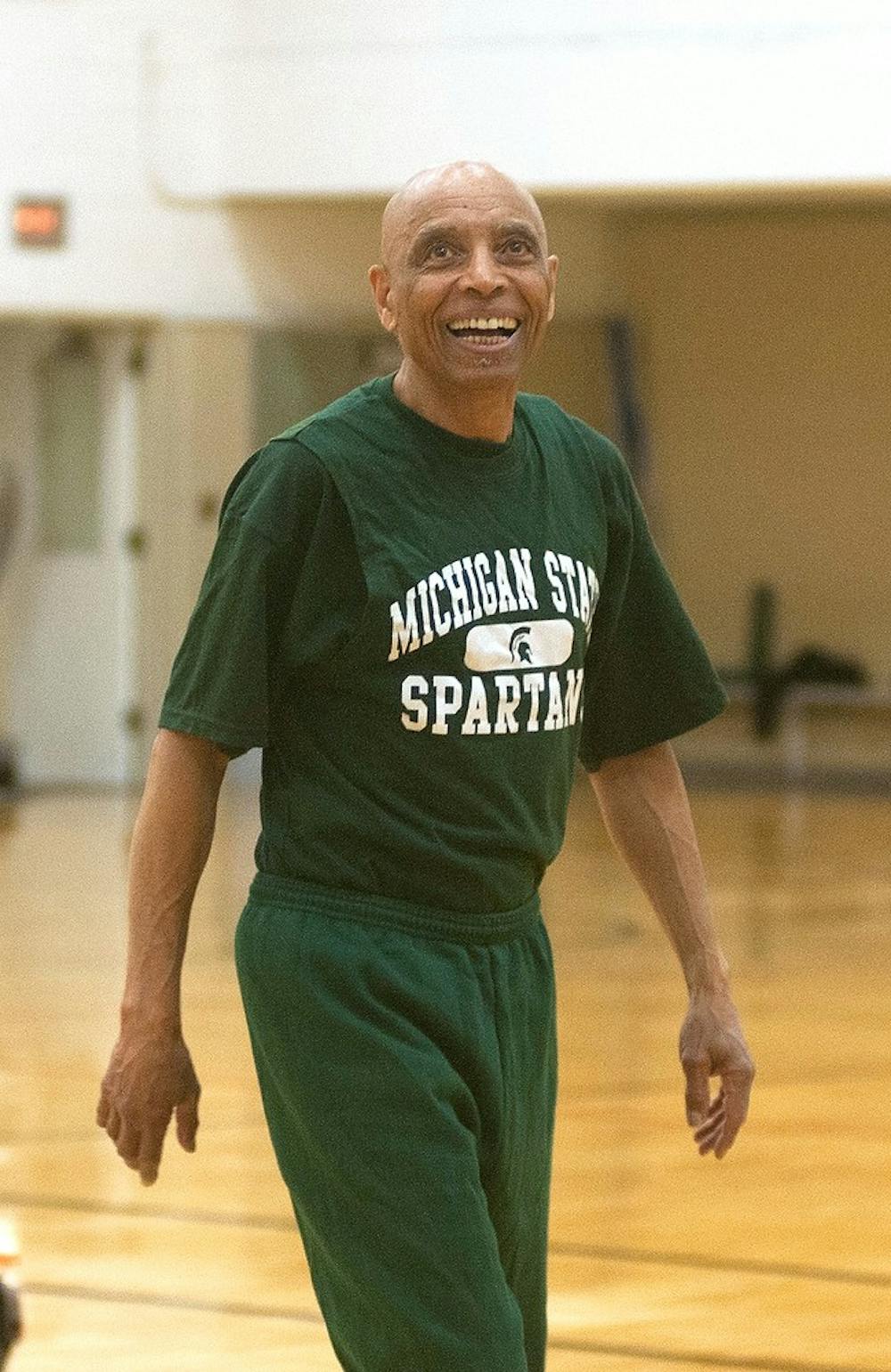 <p>East Lansing resident and 1965 MSU alumnus James E. Cummings Jr. watches his shot April 22, 2015, at IM West in the gym where he had a heart attack three and a half years ago. Cummings comes to the gym nearly every day to practice his shot and play HORSE with "young spartans." Kennedy Thatch/The State News</p>
