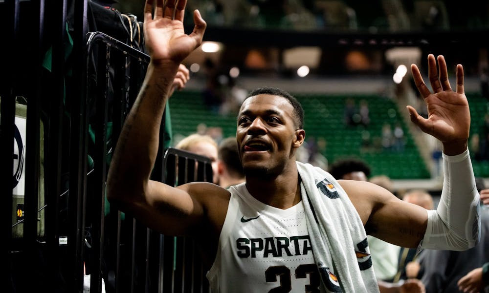 <p>Junior forward Xavier Tillman high-fives fans after a game against Albion. The Spartans defeated the Britons, 85-50, on Oct. 29, 2019 at the Breslin Student Events Center.</p>