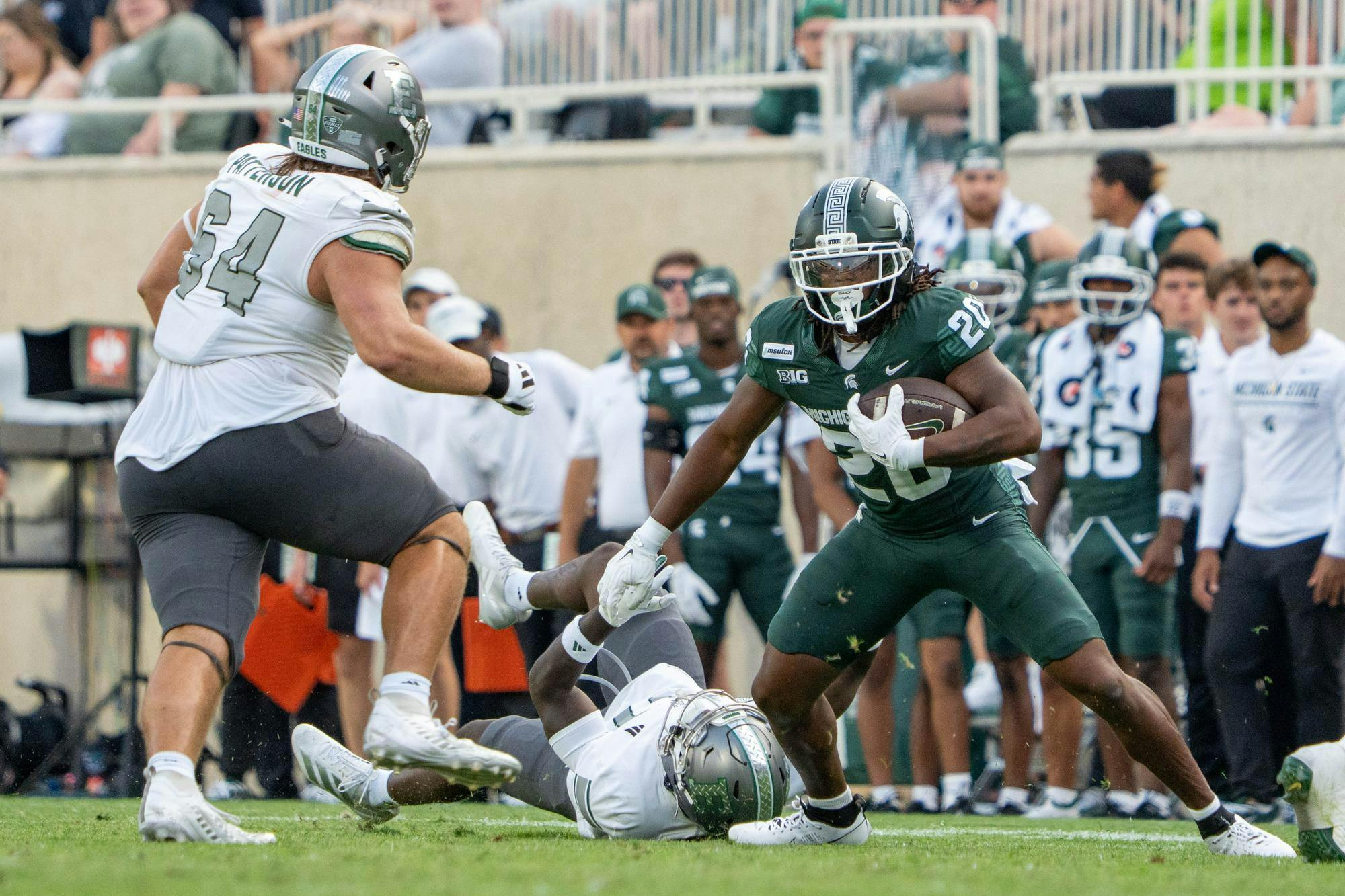 <p>Michigan State running back Zion Gist (20) runs down the field with the ball after shaking off an Eastern Michigan defender in Spartan Stadium in East Lansing, Mich., on Saturday, Sept. 12, 2026. The Spartans would end up winning the game 35-7 after a strong second half.</p>