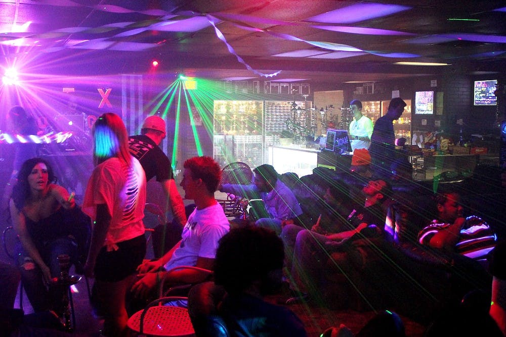 	<p>Students hangout and smoke hookah together Saturday, Feb. 4, 2012, at The Six Hookah Lounge and Smoke Shop. City officials plan to restrict any more hookah lounges coming into downtown East Lansing. State News File Photo</p>