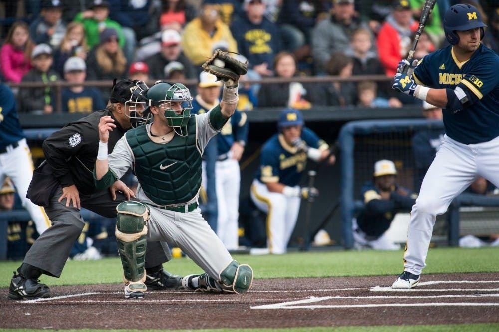 Junior catcher Matt Byars (28) catches the ball during the game against Michigan on April 29, 2016 at Ray Fisher Stadium at Wilpon Baseball Complex in Ann Arbor, Mich. The Spartans were defeated by the Wolverines, 4-3.