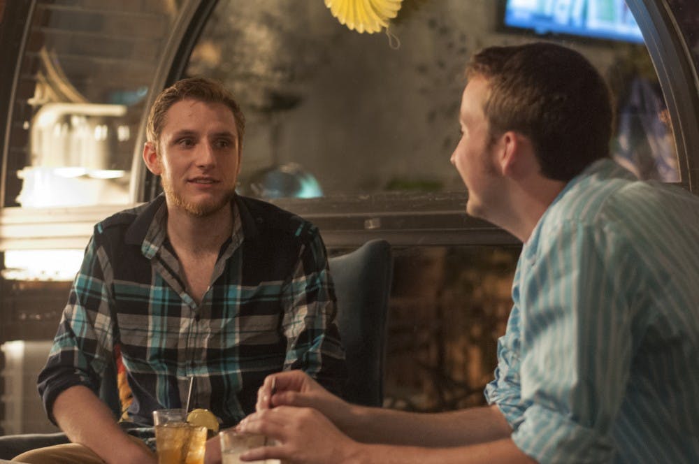 From left, genetics senior Zack Krause listens to journalism senior Harrison Thrasher talk on September 1, 2016 at Harper?s Restaurant & Brewpub in East Lansing. Krause is the chapter president of Kappa Sigma which was holding a fundraiser for veterans through the Harper's Gives Back program.