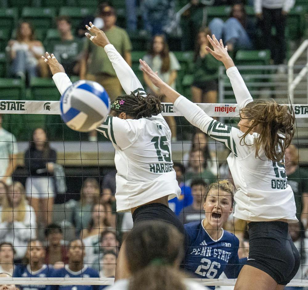 Penn state graduate student Whitney Lauenstein launches the ball past MSU Senior Zora Hardison and Junior Hayley Ogden at the Breslin Center during the MSU v Pennstate Volleyball game In East Lansing, MI on Sunday Sep. 27th, 2026