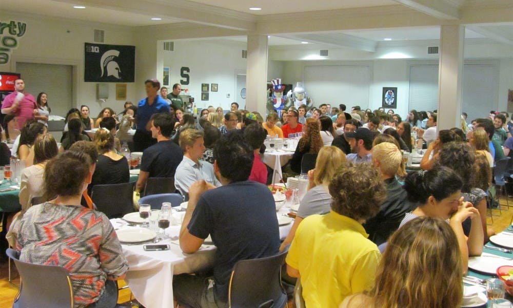 <p>People take part in a Shabbat dinner on Sept. 18, 2015 at the Lester &amp; Jewell Morris Hillel Jewish Center. It was the the Shabbat before Yom Kippur.</p>