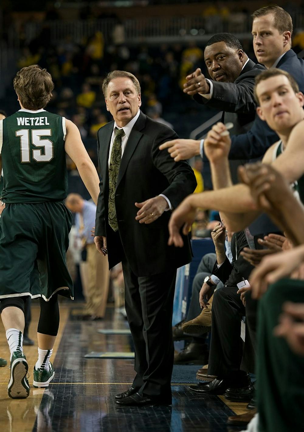 <p>Head coach Tom Izzo calls new players to the court on Feb. 17, 2015, during the game against Michigan at Crisler Center in Ann Arbor. The Spartans defeated the Wolverines 80-67. Emily Nagle/The State News</p>