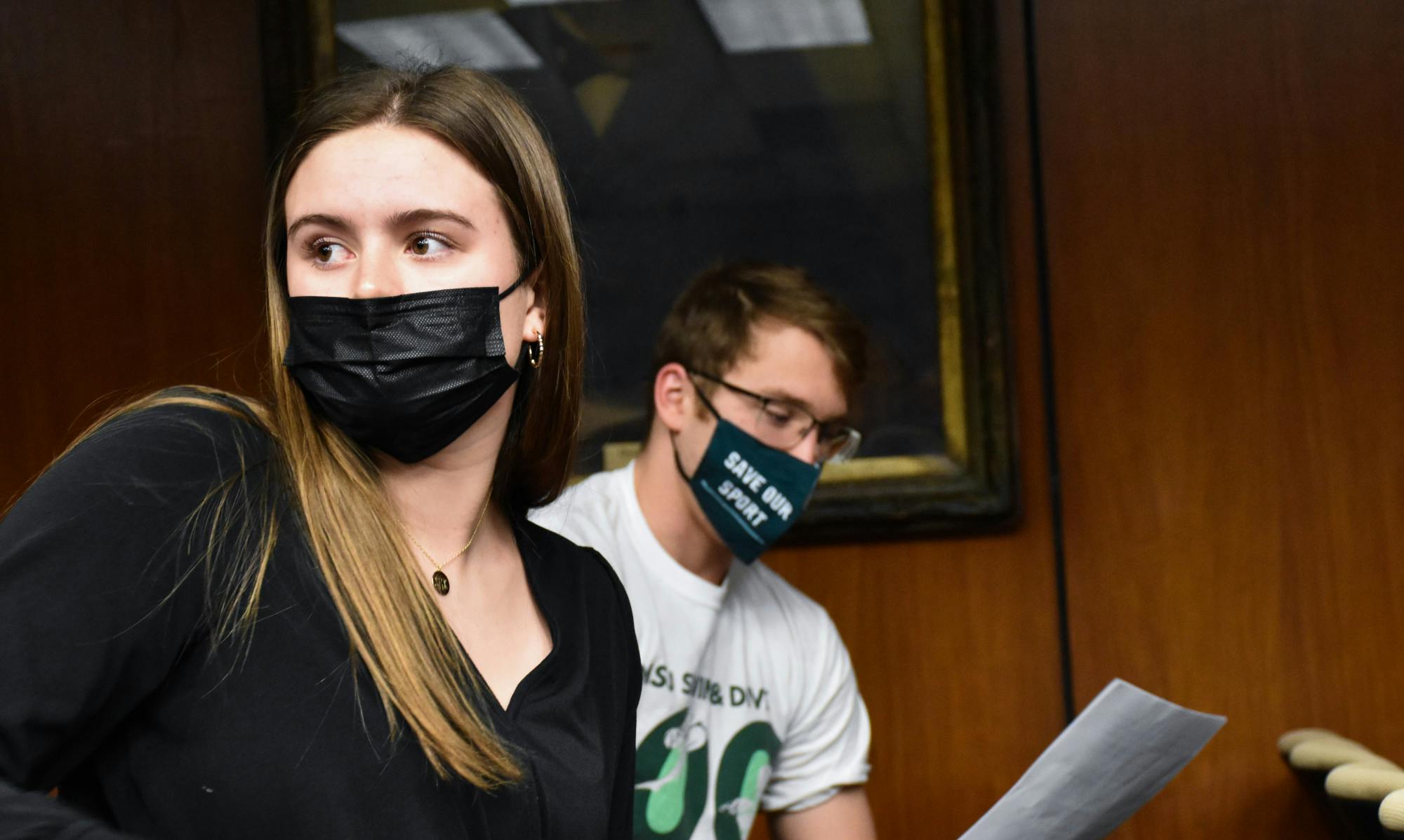 Junior freestyler Sophia Balow and junior breaststroker Travis Nitkiewicz prepare themselves for speaking in front of MSU administration at the Board of Trustees meeting on Feb 11, 2022.