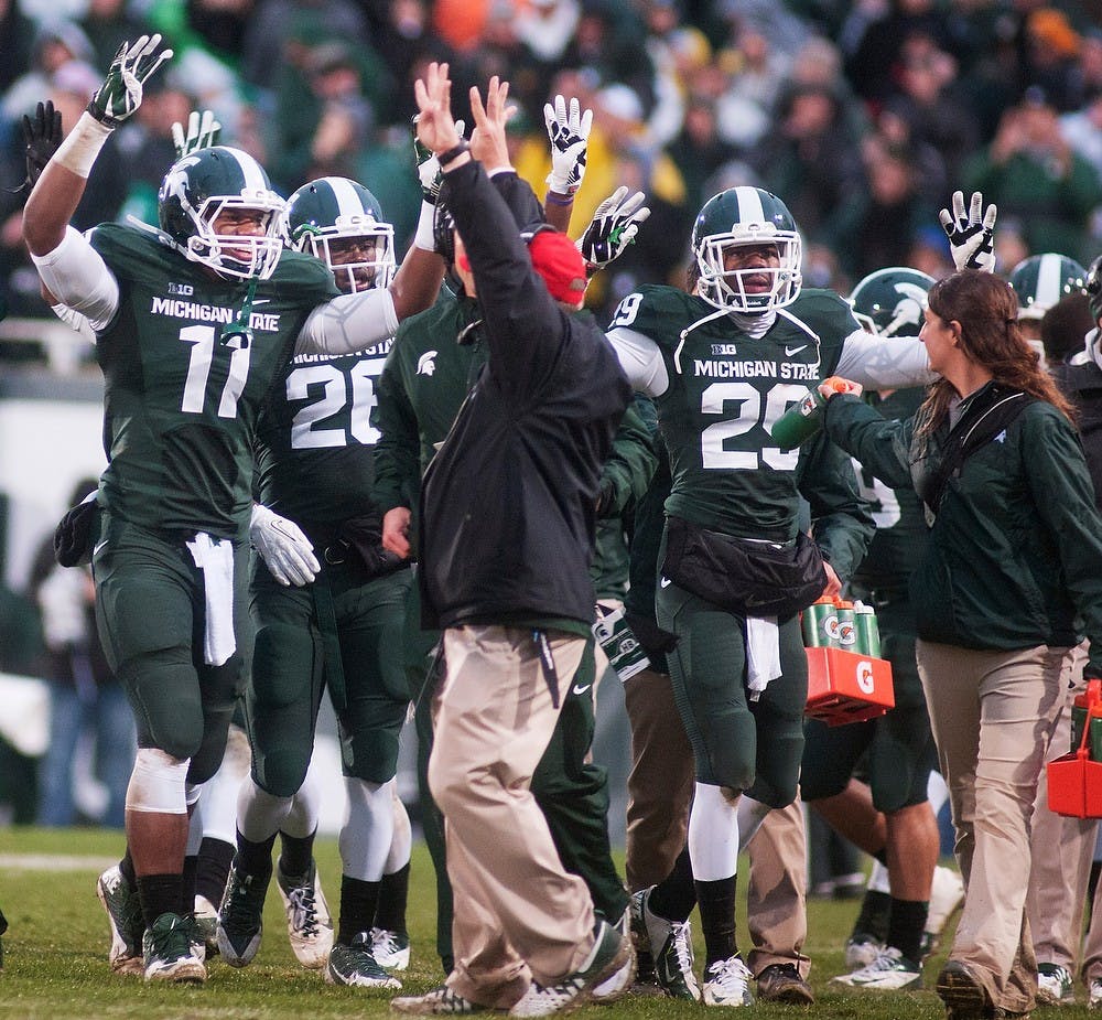 	<p>Spartans signal the start of the fourth quarter during a game against Michigan on Nov. 2, 2013, at Spartan Stadium. The Spartans defeated the Wolverines, 29-6. Georgina De Moya/The State News</p>