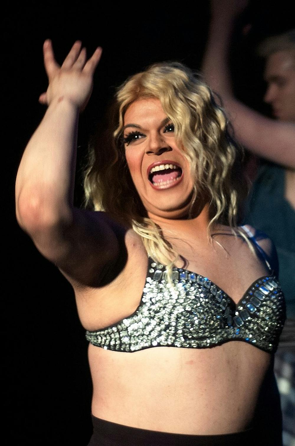 <p>Drag queen Maria Mirelez beams as she sings along to Britney Spears' "Work Bitch" at Spiral Video & Dance Bar March 30. Mirelez is a Britney Spears impersonator and had three backup dancers for the song. Emily Jenks/The State News.</p>