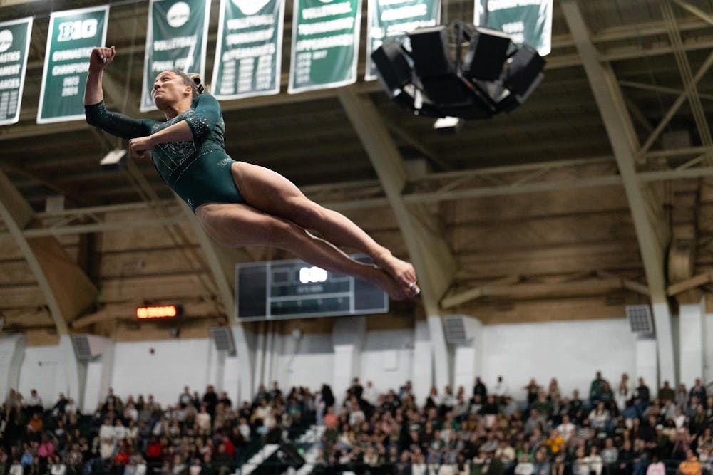 Isabella Trostel, junior, competes on vault during the MSU tri-meet at Jenison Field House on Sunday, Feb. 15, 2026.