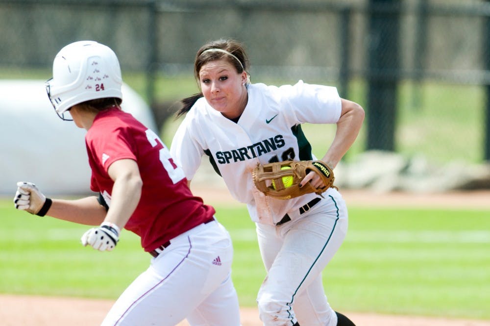 	<p>Senior shortstop Lindsey Hansen chases down Indiana outfielder Heather Nelson after she found herself in a pickle between first and second base. The Spartans lost Saturday&#8217;s game to Indiana, 7-2. Matt Hallowell/The State News</p>