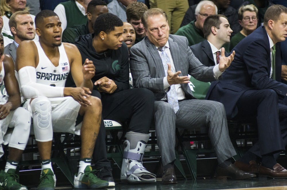 Head coach Tom Izzo, right, interacts with freshman forward Mikles Bridges (22) during the first half of the men's basketball game against Oral Roberts on Dec. 3, 2016 at Breslin Center. The Spartans defeated the Golden Eagles, 80-76.