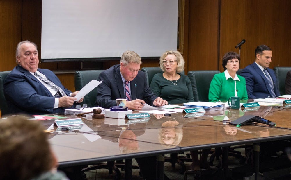 MSU Interim President John Engler and the Board of Trustees listen during public comment at the Board of Trustees meeting on Oct. 26, 2018.