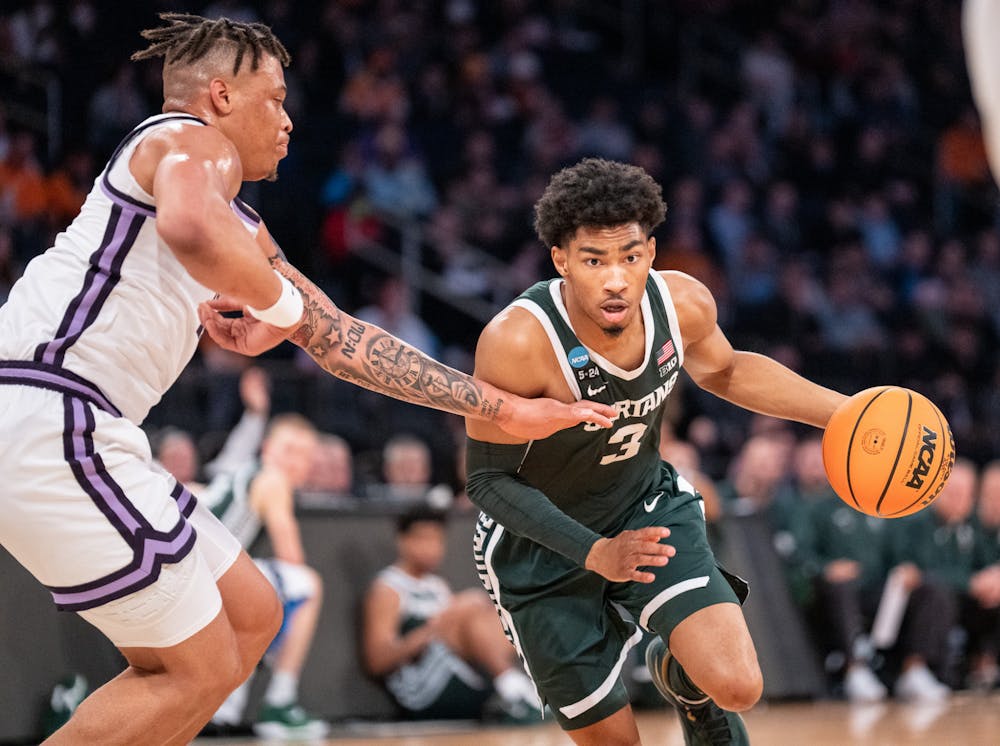 Sophomore forward Jaden Akins makes his way around the Wildcats during the Sweet Sixteen matchup against Kentucky State University at Madison Square Garden on March 23, 2023. The Spartans fell to the Wildcats with a score of 98-93. 