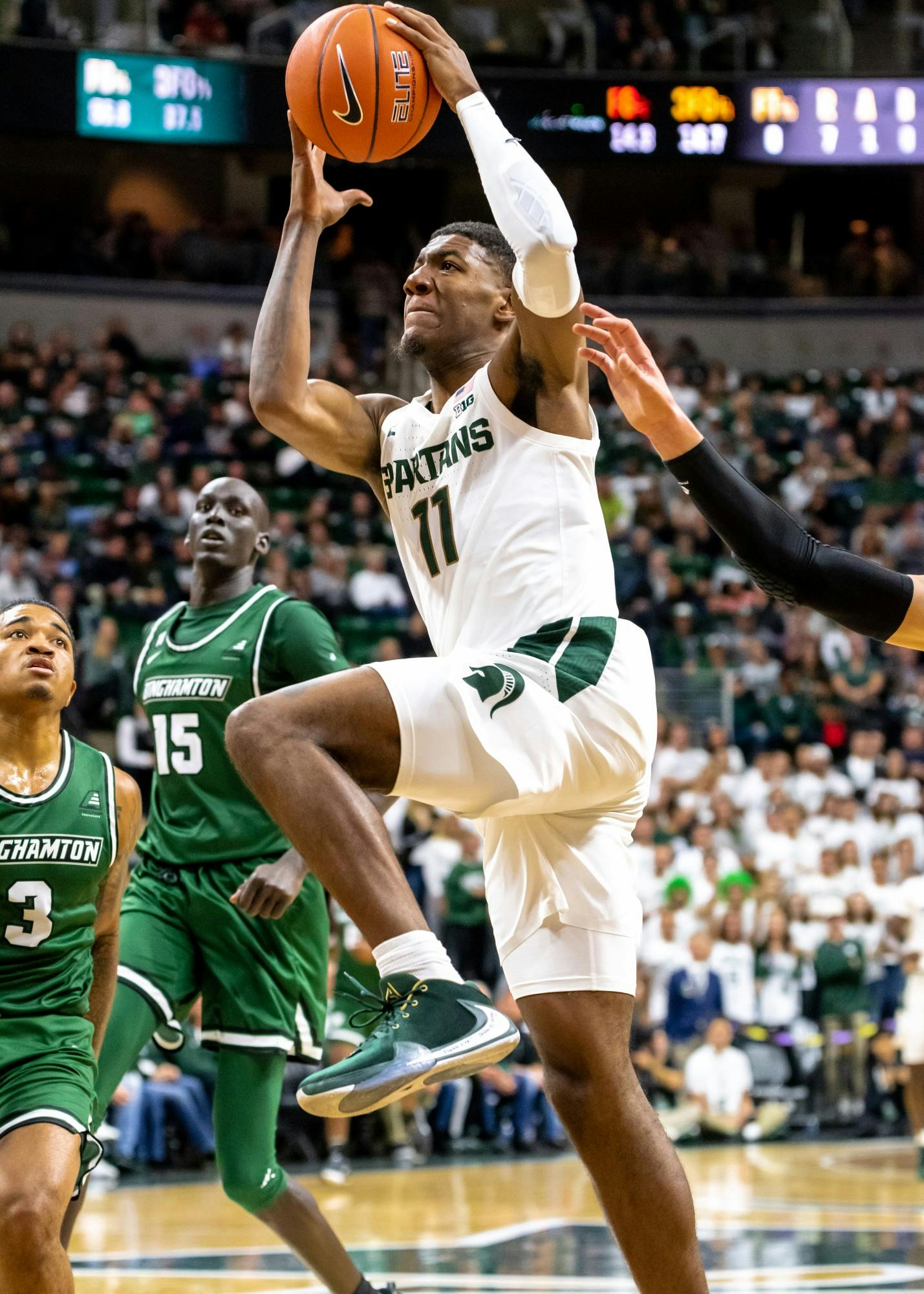 <p>Sophomore forward Aaron Henry goes up for a shot against Binghamton. The Spartans defeated the Bearcats 100-47 at the Breslin Student Events Center on Nov. 10, 2019. </p>