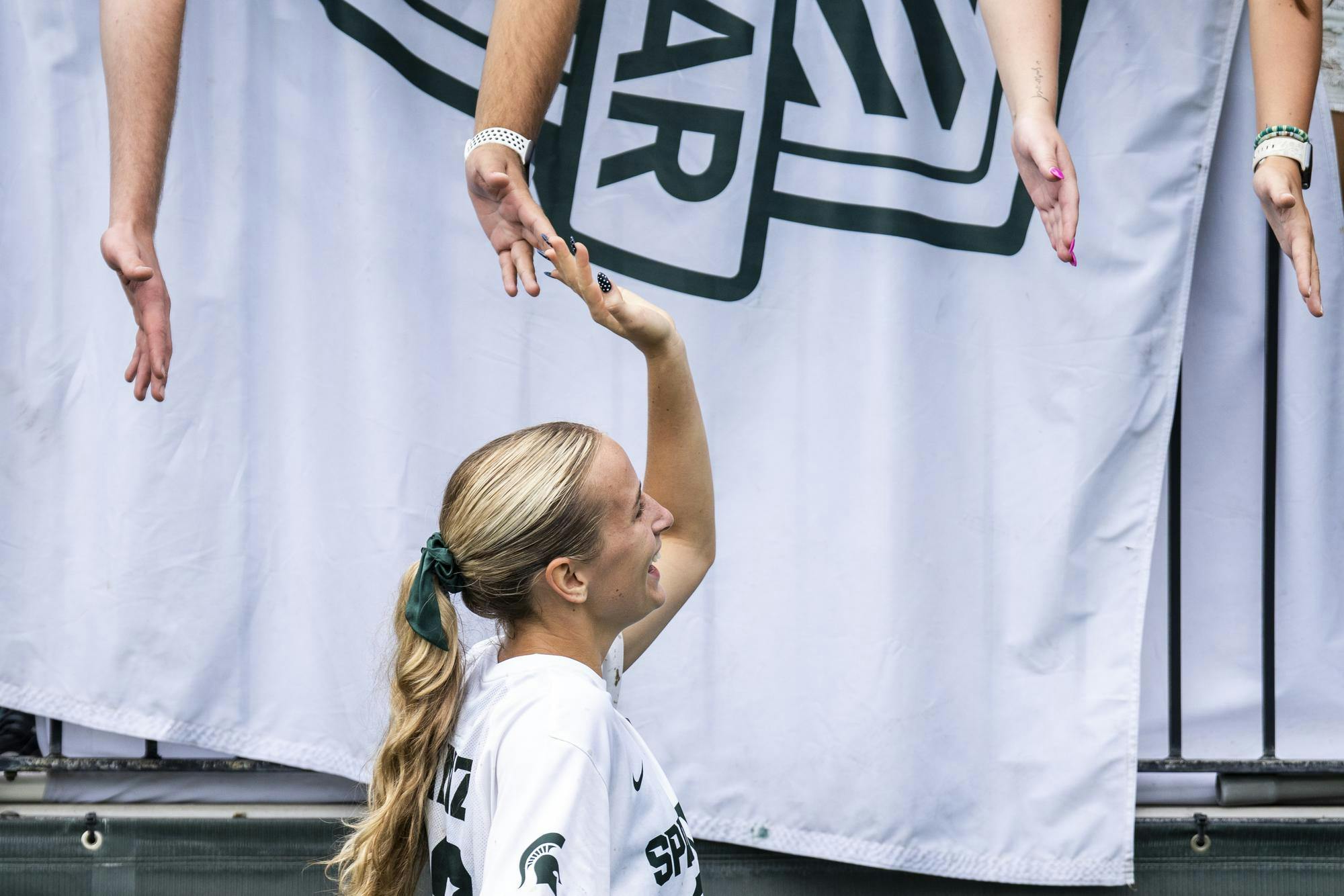 <p>Michigan State senior midfielder Ella Janz (22) celebrates with fans after the Michigan State vs. Colorado women's soccer game at DeMartin Stadium in East Lansing, Mich., on Sunday, Aug. 30, 2026.</p>