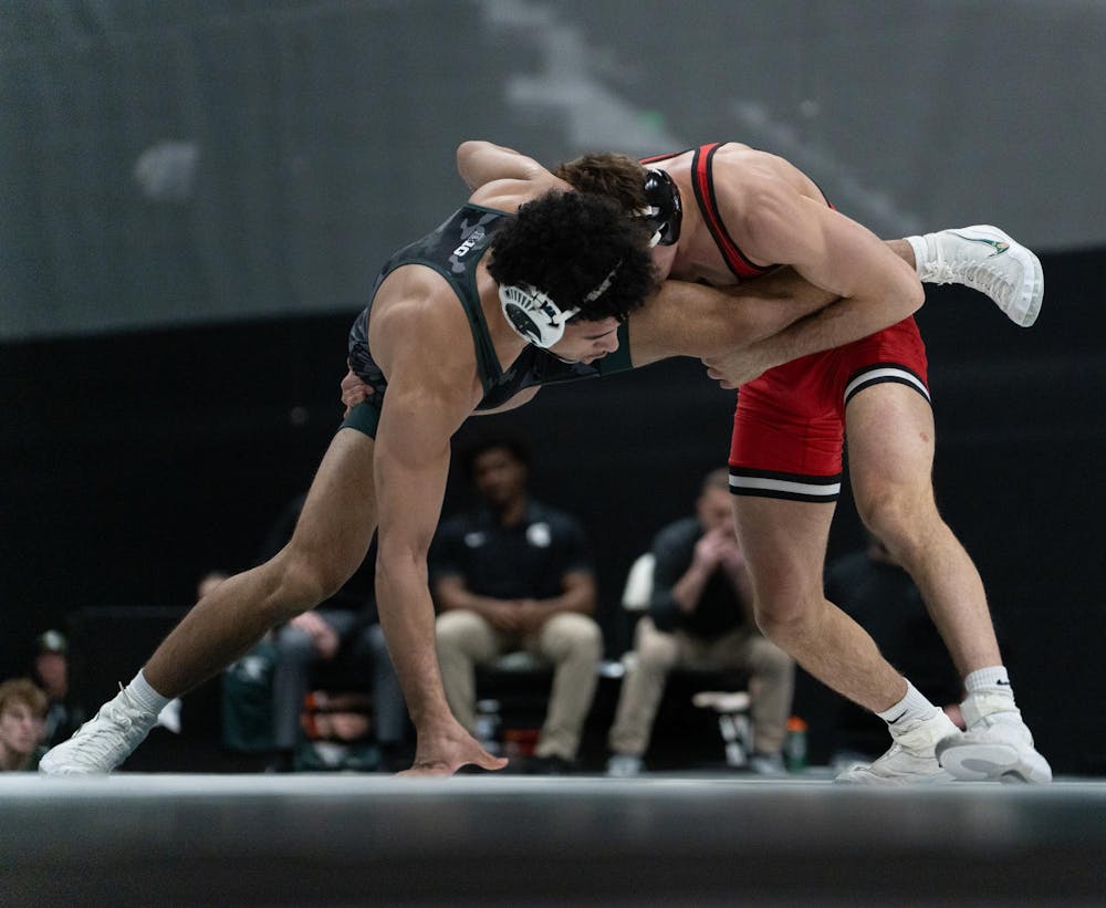 Redshirt freshman Darius Marines works to escape from a Rutgers opponent during the dual match at Jenison Field House on Feb. 13, 2026.
