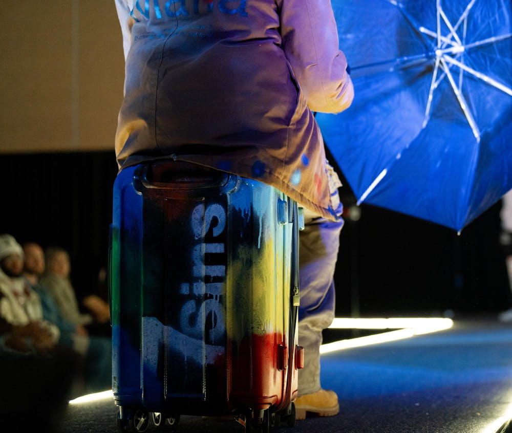 A model poses during N Crowd magazine’s fall fashion show at The Lansing Center on Dec. 8, 2024. N Crowd, a fashion magazine and non-profit organization for creatives at MSU, holds a fashion show every semester.
