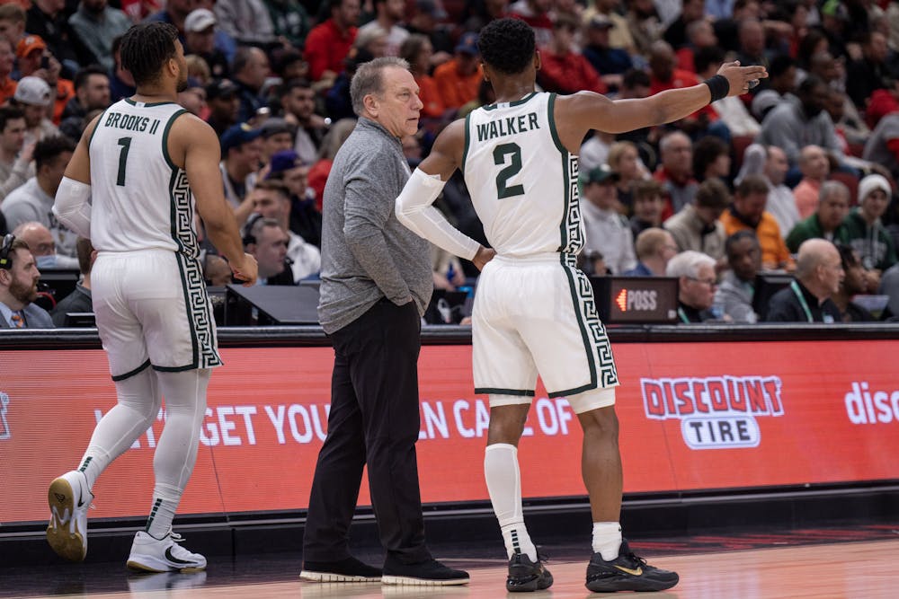 <p>Senior Tyson Walker consults with head men's basketball coach Tom Izzo during Michigan State's contest against Ohio State during the Big Ten Tournament in Chicago, Illinois on March 10, 2023. Michigan State would go on to lose the game, 58-68.</p>