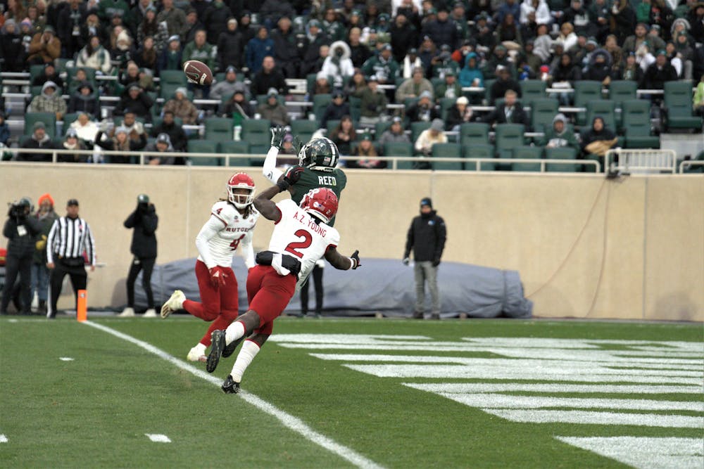 <p>Spartan wide receiver Jayden Reed﻿ catches the ball for a touchdown during the match against Rutgers on Nov. 12, 2022.</p>