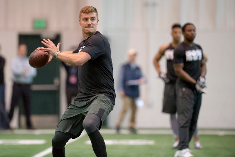 Quarterback Connor Cook throws a football during Pro Day on March 16, 2016 at Skandalaris Football Center.