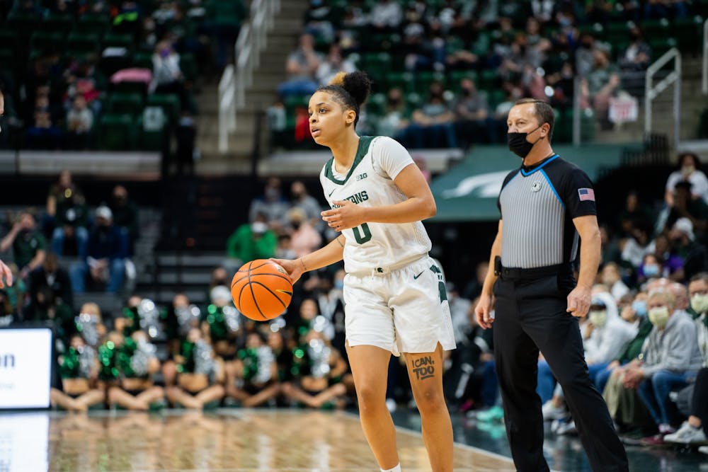 <p>Freshman guard DeeDee Hagemann (0) dribbles up the court. The Spartans lost 61-55 against Ohio State University at the Breslin Center on Feb. 27, 2022.</p>