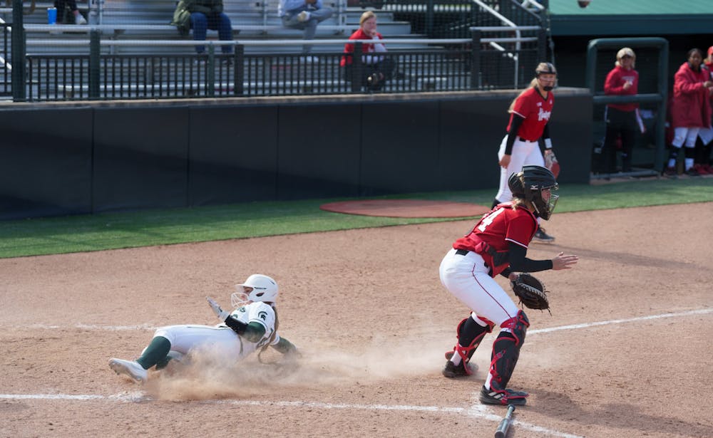 <p>Michigan State junior Brooke Snyder runs home scoring for the Spartans in the fourth inning. Spartans lost 5-4 against Nebraska, on April 10, 2022.</p>