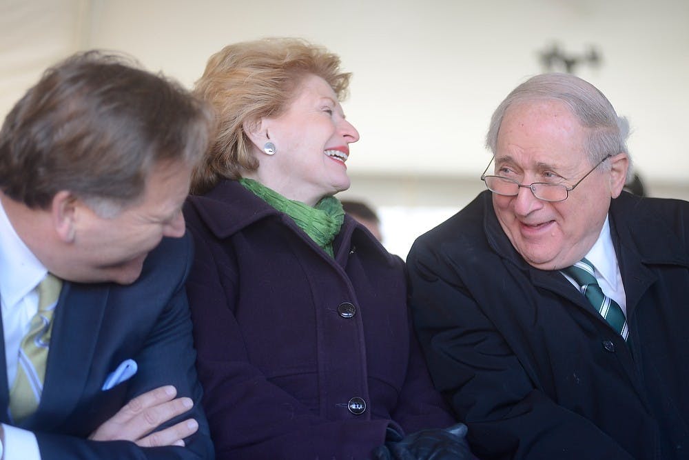 <p>U.S. senators Carl Levin, right, and Debbie Stabenow, D-Mich., and U.S. Rep. Mike Rogers, R-Mich., share a laugh March 17, 2014, for the Facility for Rare Isotope Beams, FRIB, groundbreaking across from the Wharton Center. FRIB will support the mission of the Office of Nuclear Physics to serve nuclear scientists all over the world. Julia Nagy/The State News</p>