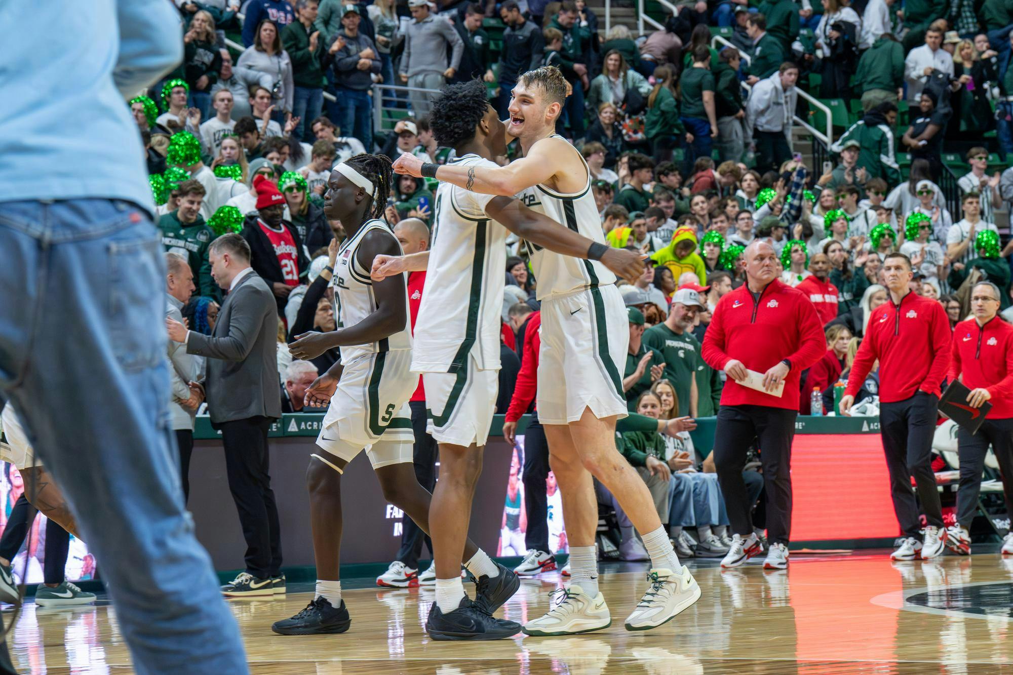 <p>Michigan State senior center Carson Cooper (15) and freshman forward Cam Ward (3) celebrate after a 66-60 victory over Ohio State University at the Breslin Center in East Lansing, Michigan, on Sunday, Feb. 22, 2026.</p>