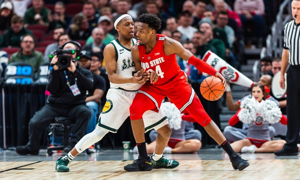 <p>Junior guard Cassius Winston guards Ohio State&#x27;s Andre Wesson. The Spartans beat the Buckeyes, 77-70, at the United Center on March 15, 2019.</p>