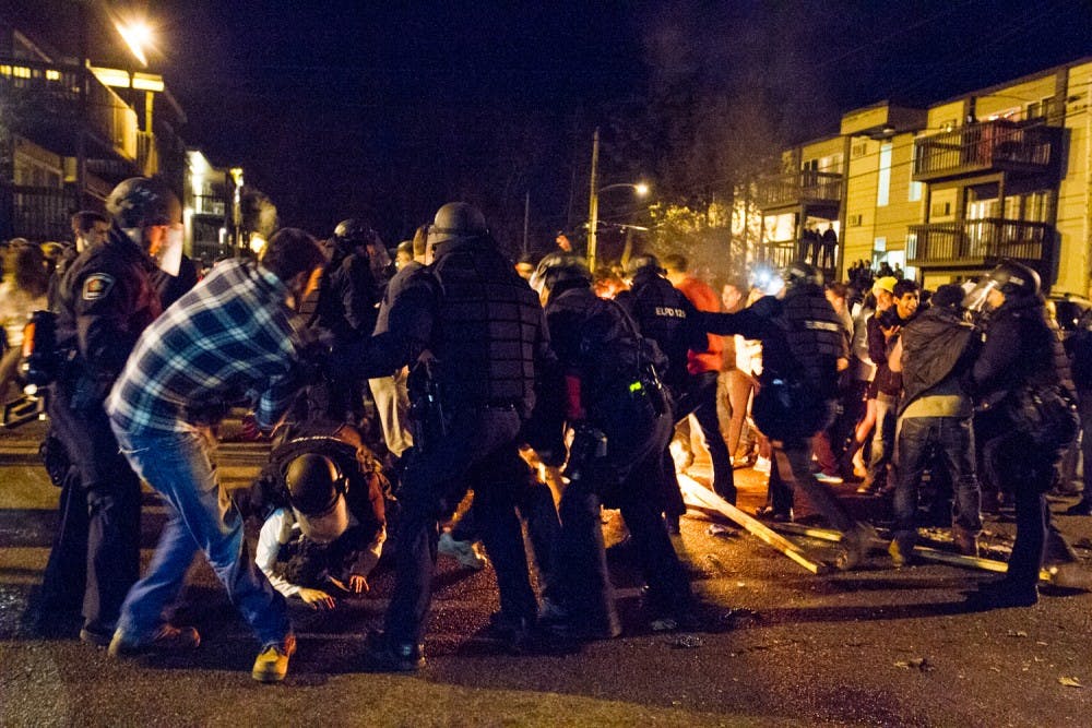 <p>Police disperse the crowd of revelers on Waters Edge Drive and Cedar Street, on March 28 after MSU's victory over Oklahoma in the Sweet 16. Multiple individuals were arrested in the assembly which lasted just over an hour.</p>