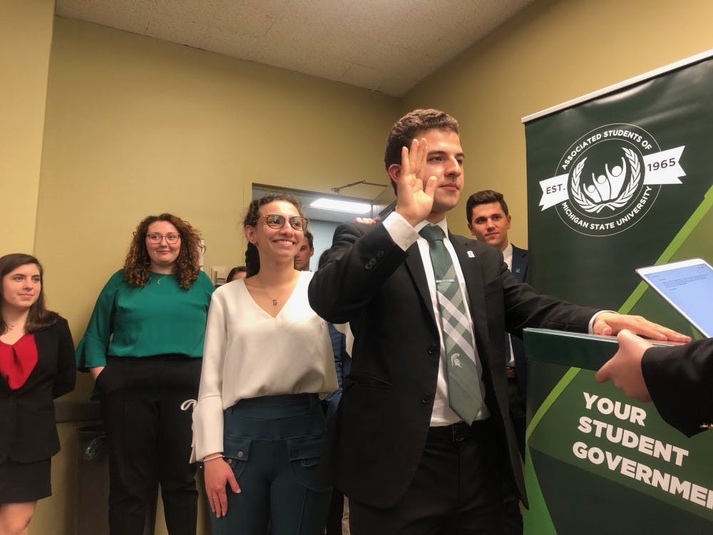 ASMSU President-elect Mario Kakos and other newly-elected members of the 2019-20 session were sworn in April 18. His predecessor Cookie Rifiotis stands by him. 