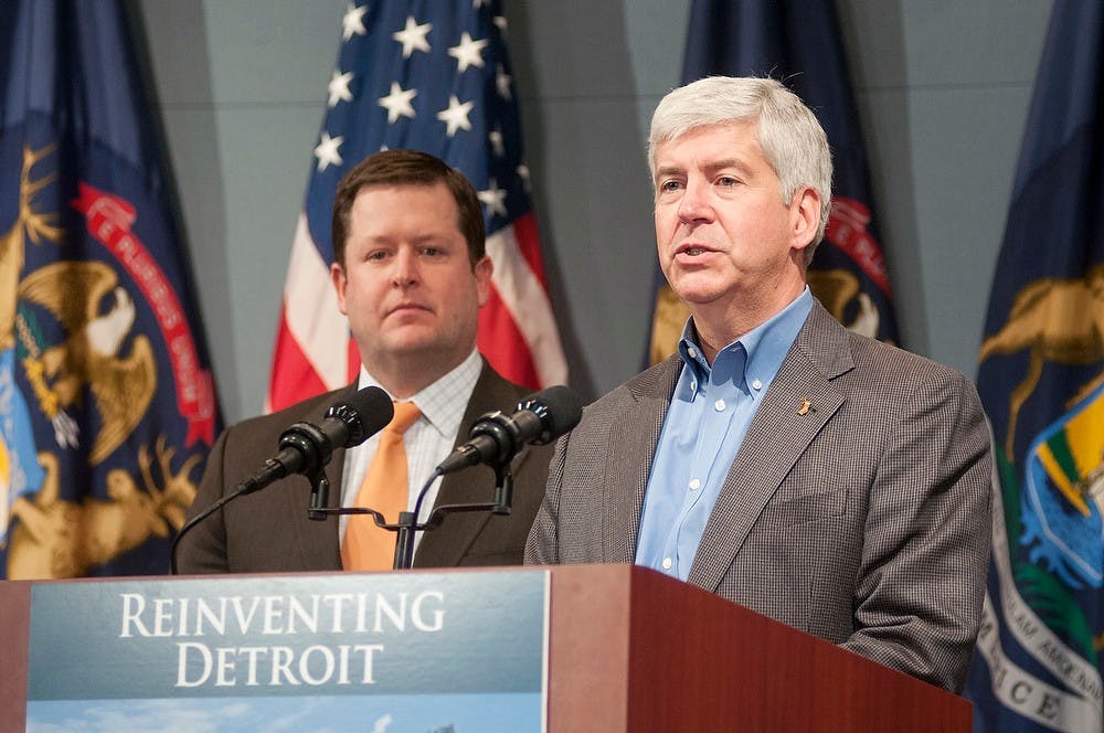 	<p>Gov. Rick Snyder addresses the media during a press conference, Jan. 22, 2014, at The George W. Romney Building, 111 South Capitol Ave., in Lansing. Snyder addressed the decision to work with state legislature to allocate funds to assist in saving retiree pensions and to keep the city of Detroit on a path to revitalization. Danyelle Morrow/The State News</p>