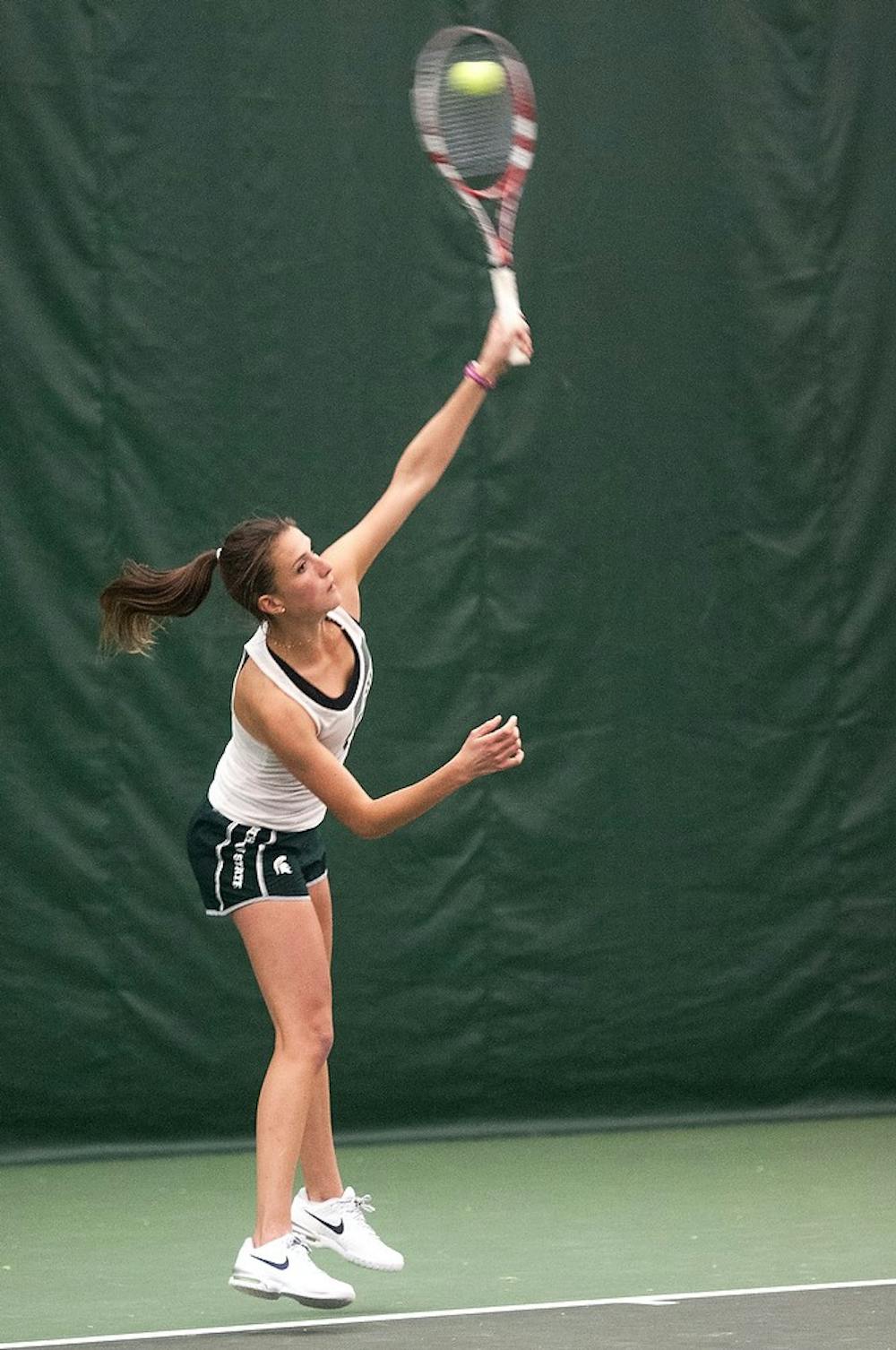 <p>Senior Marina Bohrer serves the ball during practice April 16, 2014, at the MSU Indoor Tennis Facility. Bohrer was named Big Ten Women's Tennis Athlete Of The Week last week. Danyelle Morrow/The State News</p>