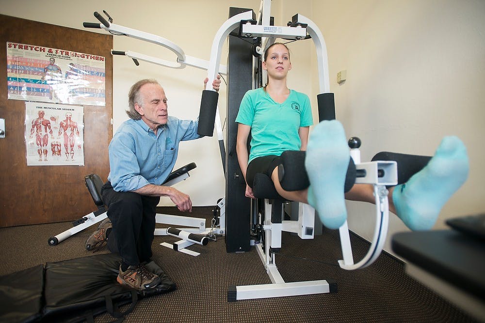 	<p><span class="caps">LIFE</span>:Rx program manager Jonathan Kermiet tests genomics and molecular genetics senior Nikki Pawloske&#8217;s fitness during a <span class="caps">LIFE</span>:Rx appointment on Oct. 24, 2013, at the Olin Health Center. Pawloske performed a variety of strength tests to get a complete profile of her health. Julia Nagy/The State News</p>