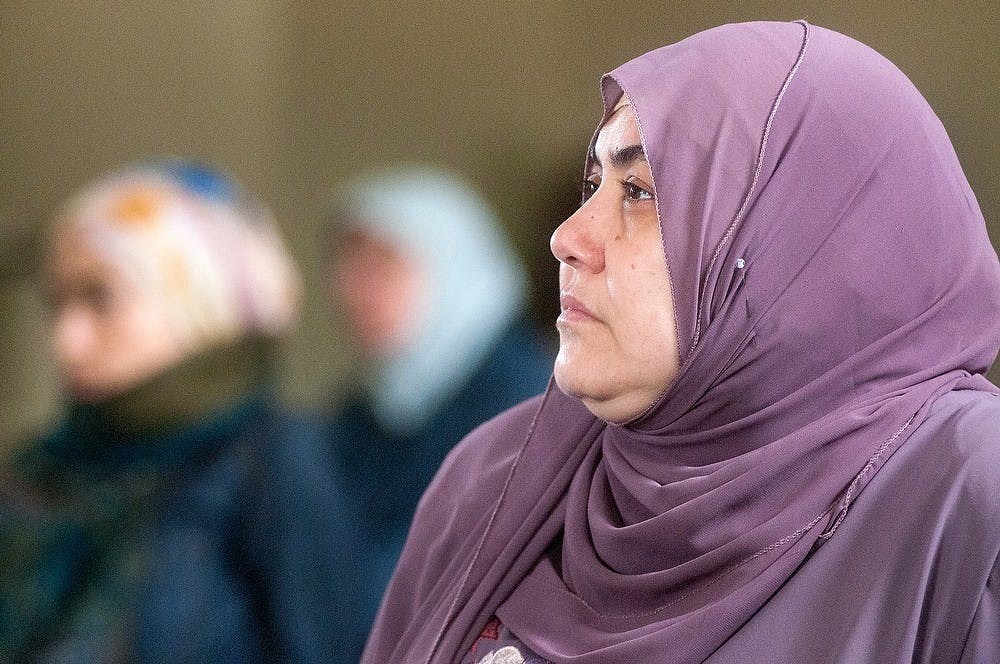 	<p>East Lansing resident Hanaa Elwakil listens to a sermon at the Islamic Society of Greater Lansing, 940 South Harrison Road, on May 10, 2013. Elwakil said the Quran, the central religious text of Islam, acts as a guide in her daily life. Julia Nagy/The State News</p>