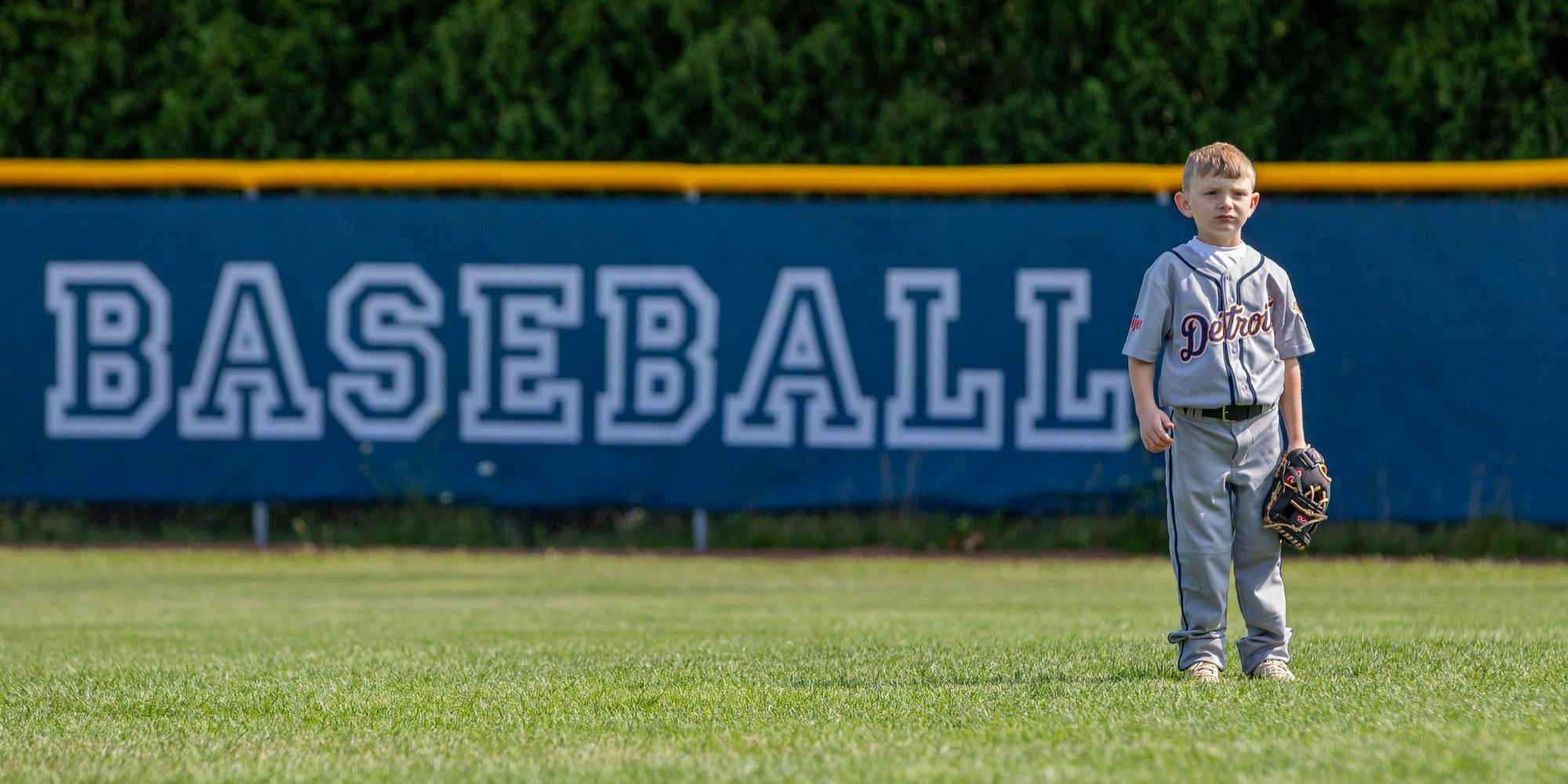 <p>A young camper at the Detroit Tigers youth camp stands in the outfield waiting for a ball in East Lansing, Mich., on July 22, 2026.</p>
