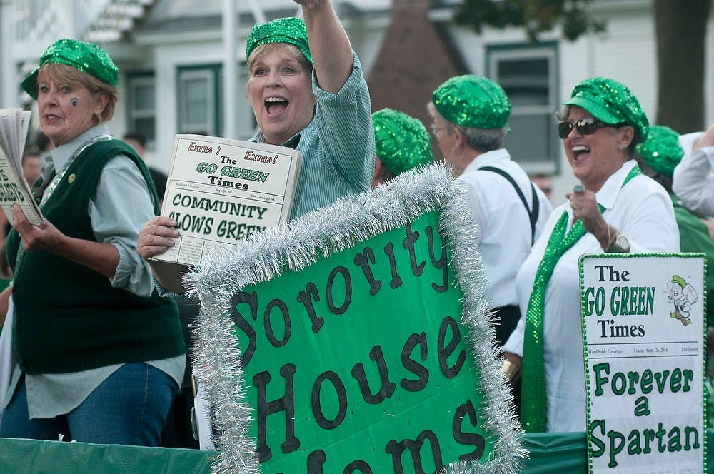 <p>The Sorority House Moms greet the crowd on their float Sept. 26, 2014, during the MSU Homecoming Parade on Abbot Road. The parade started on Abbott Road and ended on-campus at Farm Lane and Shaw Lane. Raymond Williams/The State News</p>