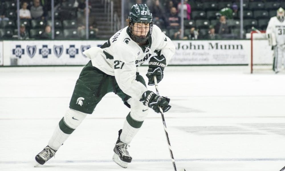 <p>Sophomore forward&nbsp;Mason Appleton (27) brings the puck up the rink during the third period in the exhibition game against U.S. National Team Development Program U-18 Program on Dec. 4, 2016 at Munn Ice Arena. The Spartans defeated the U.S. National Team Development Program U-18, 5-1.</p>
