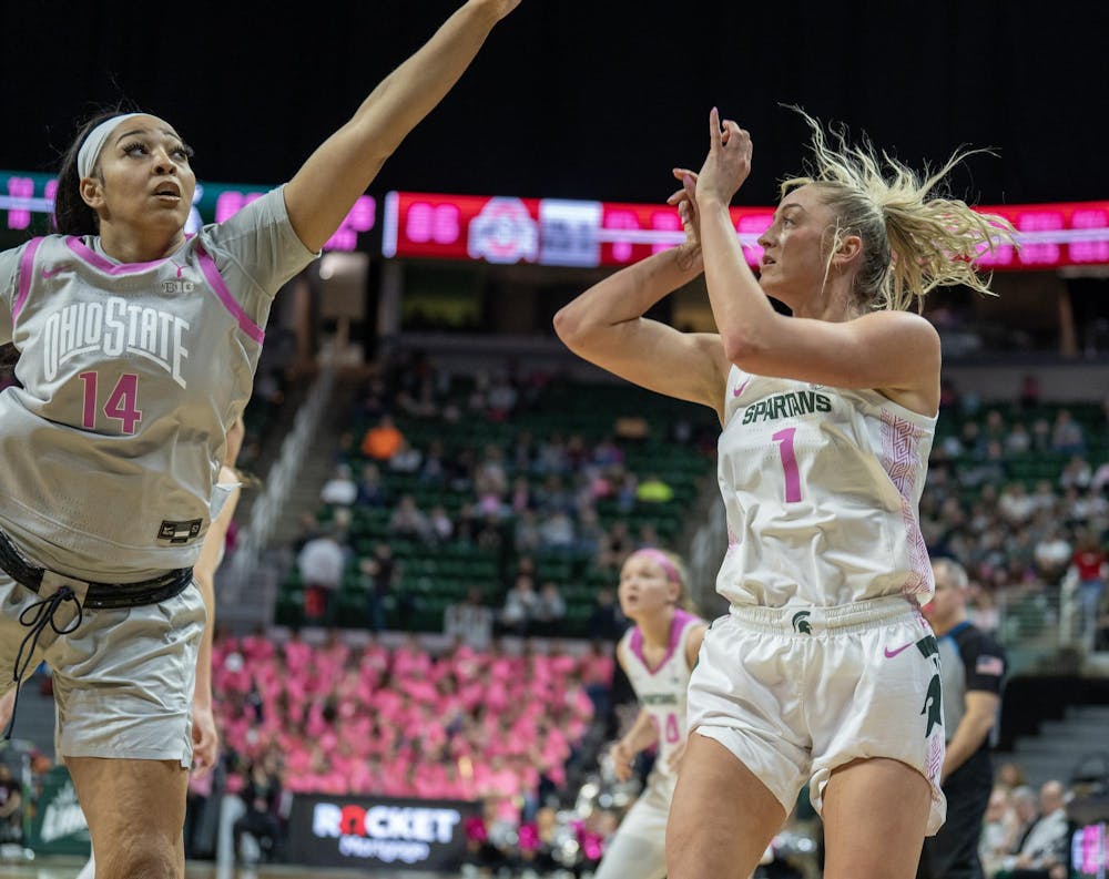 <p>Graduate guard/forward Tory Ozment (1) shoots the ball as opponent graduate forward Taiyier Parks (14) attempts to block the shot at the Breslin Center on Feb. 11, 2024. The Spartans lost to the Buckeyes 71-86.</p>