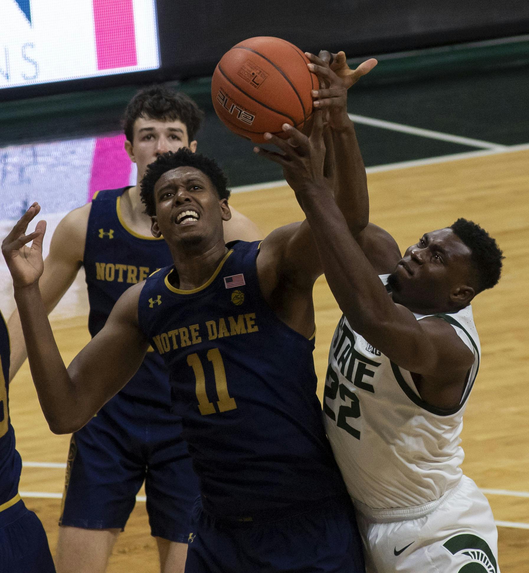 <p>Freshman center Mady Sissoko (22) fights to regain the ball after a failed shot at the basket in the second half. Michigan State triumphed over Notre Dame, 80-70, on Nov. 28, 2020. </p>