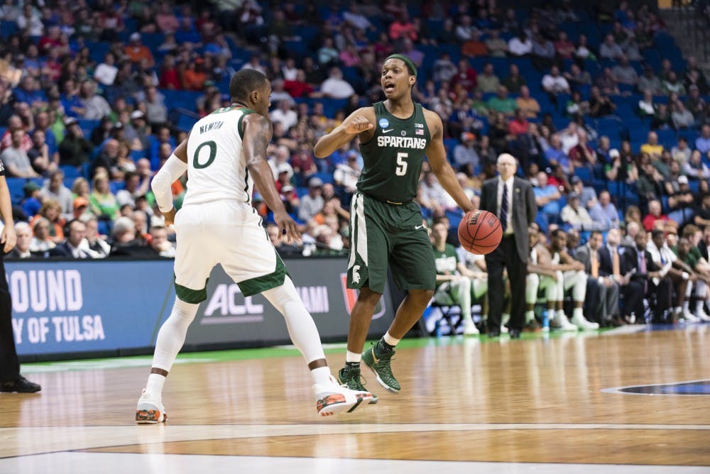 Freshman guard Cassius Winston (5) motions to his teammates during the second half of the game against University of Miami (Fla.) in the first round of the Men's NCAA Tournament on March 17, 2017 at  at the BOK Center in Tulsa, Okla.The Spartans defeated  the Hurricanes, 78-58.