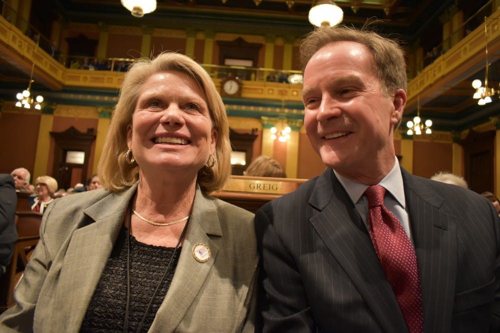 Secretary of State Ruth Johnson, left, and Attorney General Bill Schuette, right, listen to Governor Rick Snyder's eighth and final State of the State address on Jan. 23. 