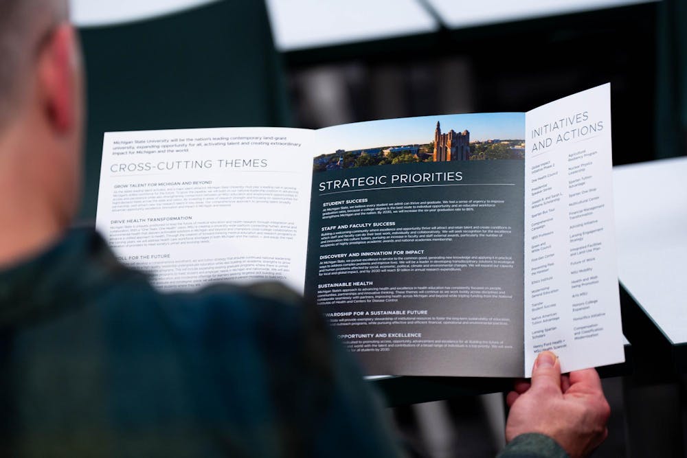 strategic priorities pamphlet during ASMSU meeting at MSU International Center, in East Lansing, on Dec. 4th, 2025. 