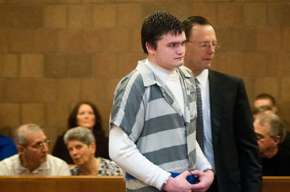 	<p>Okemos resident Connor McCowan is escorted into the courtroom by his attorney, Chris Bergstrom, during the preliminary exam of the fatal stabbing of <span class="caps">MSU</span> student Andrew Singler on April 18, 2013, at Ingham County District Judge Donald Allen&#8217;s courtroom in Mason, Mich. McCowan is standing trial for allegedly killing 23-year-old Singler in February. Natalie Kolb/The State News</p>