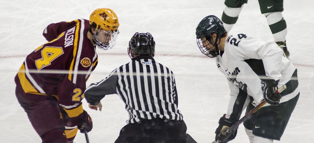 Senior forward Austin Kamer (24) prepares to face off against Minnesota's Jaxon Nelson (24) in the second period. The Spartans fell to the Golden Gophers, 3-1, on Dec. 3, 2020.