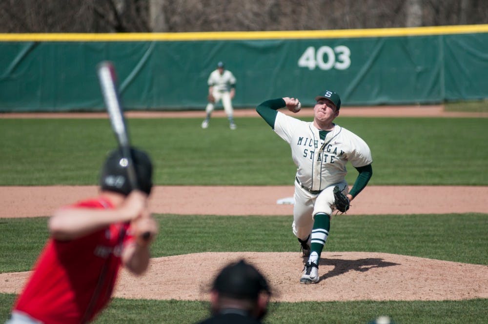 Junior right hand pitcher Walter Borkovich pitches the ball during the game against Rutgers on March 27, 2016 at McLane Baseball Stadium at Kobs Field. The Spartans defeated the Scarlet Knights, 6-5.